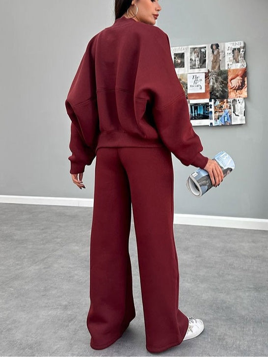 Women's zip-up cardigan and straight leg trousers suit